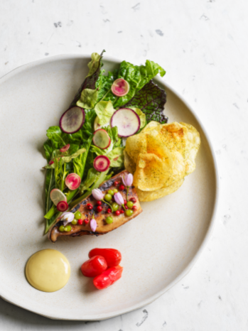 Cured king oyster mushroom, grilled over cherry wood with spring salads, elm seeds, preserved radishes and a sauce of smoked sunflower seeds and buckwheat miso by Nurdin Topham